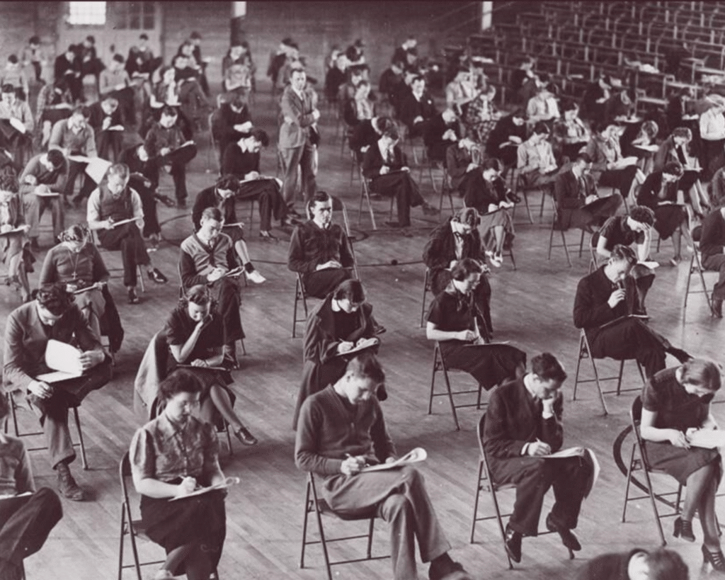 Black and white photograph of students test. Photo courtesy of Hamline University, adapted by CLT. Original licensed CC BY-SA 3.0 via Wikimedia Commons. This adaptation is licensed CC BY-SA 3.0.